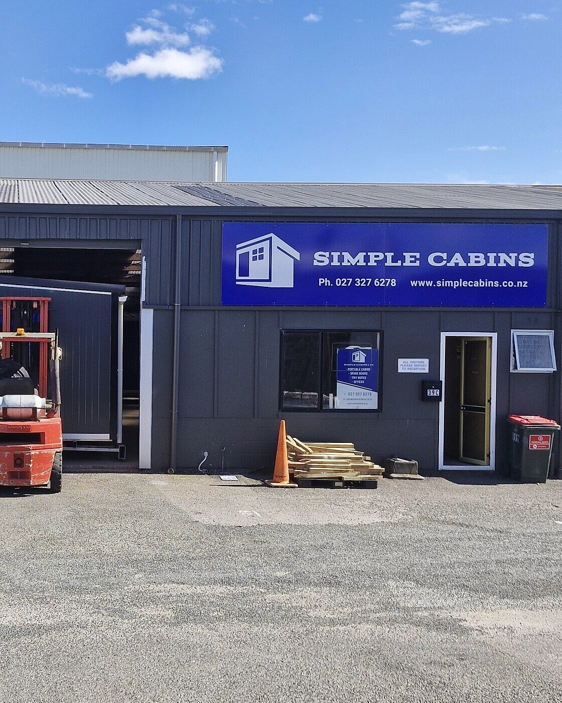 The Simple Cabins workshop at 39C Connett Road West, Bell Block, with a forklift out front on a sunny day
